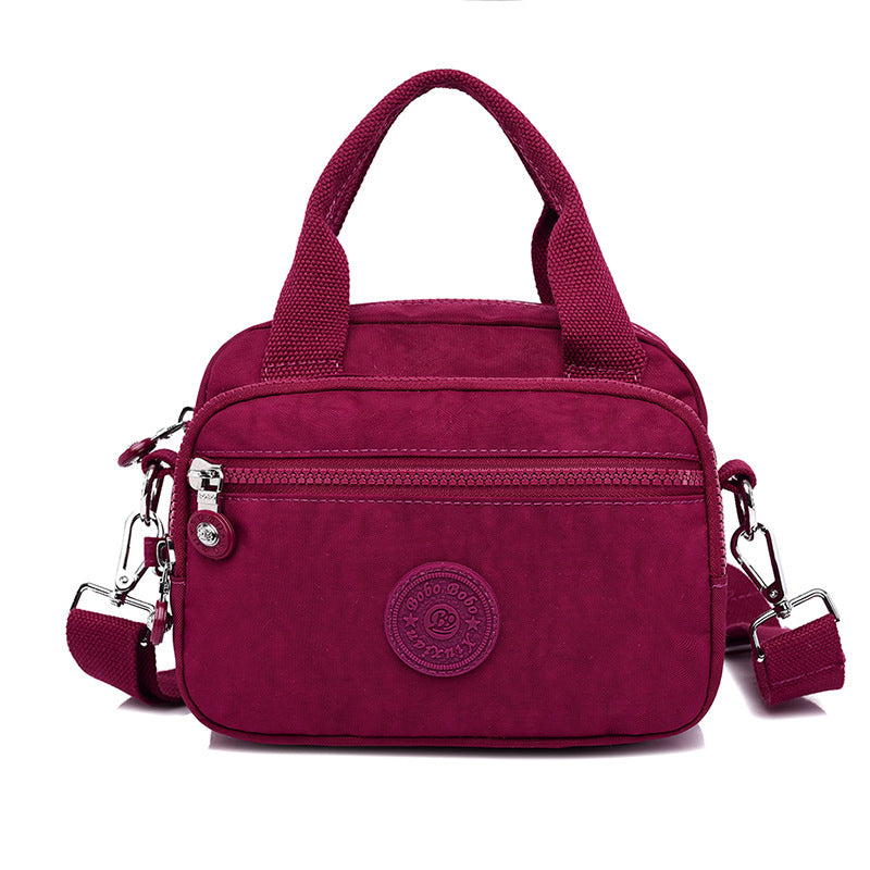 bags : DOUTZEN™ | Effen Kleur Casual Nylon Schoudertas Met Rits in Bordeaux Rood van Pantino