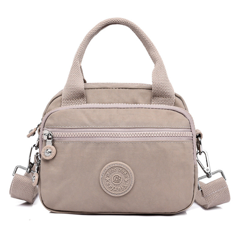 bags : DOUTZEN™ | Effen Kleur Casual Nylon Schoudertas Met Rits in Beige van Pantino